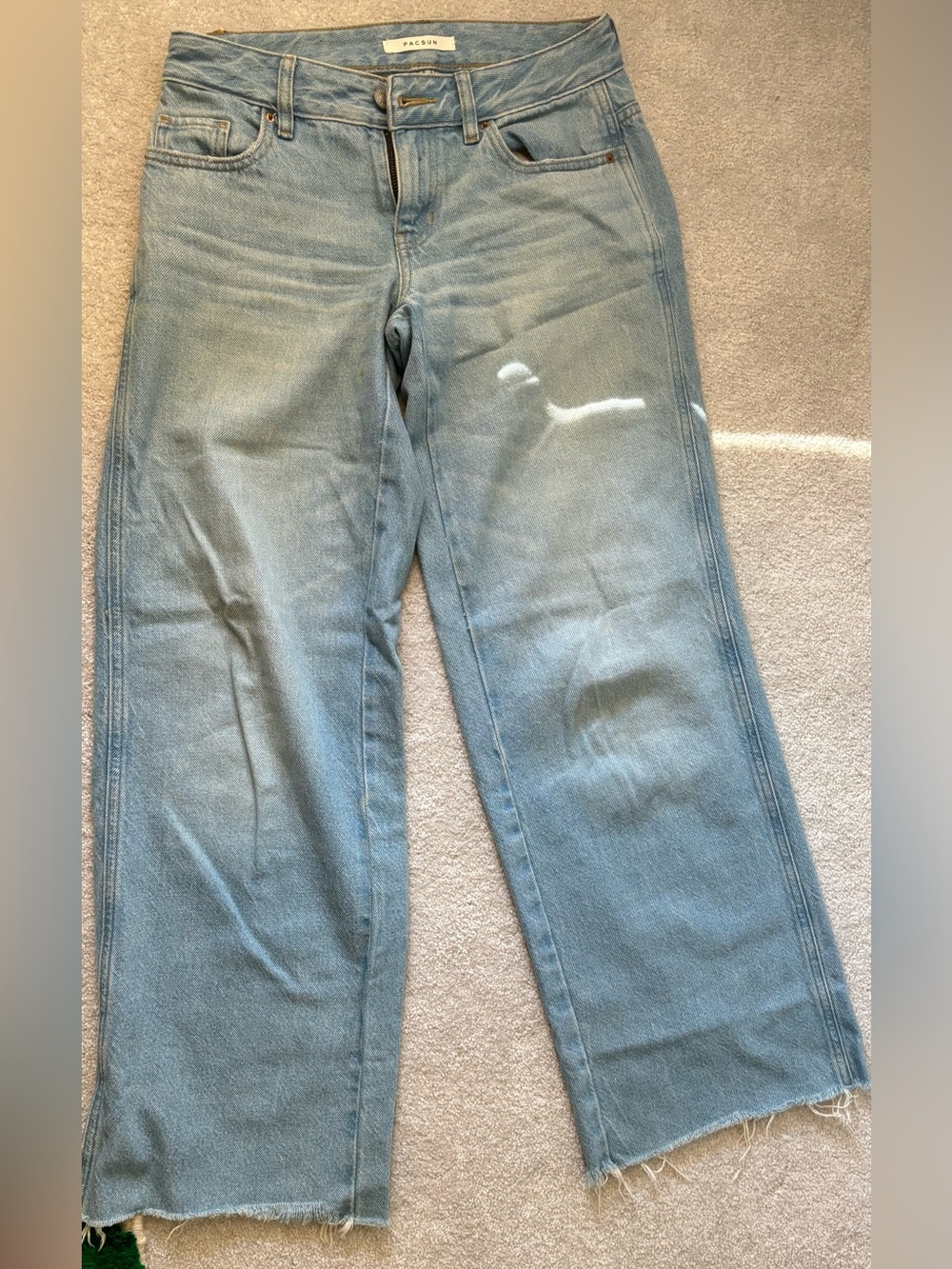light wash baggy low rise jeans